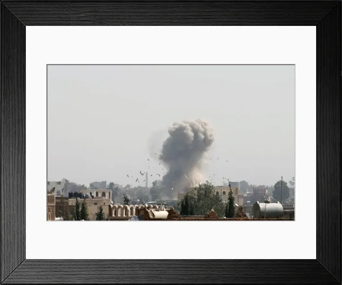 Framed Print : Smoke and debris rise from the site of a Saudi-led air strike in Sanaa Framed Print : Smoke and debris rise from the site of a Saudi-led air strike in Sanaa