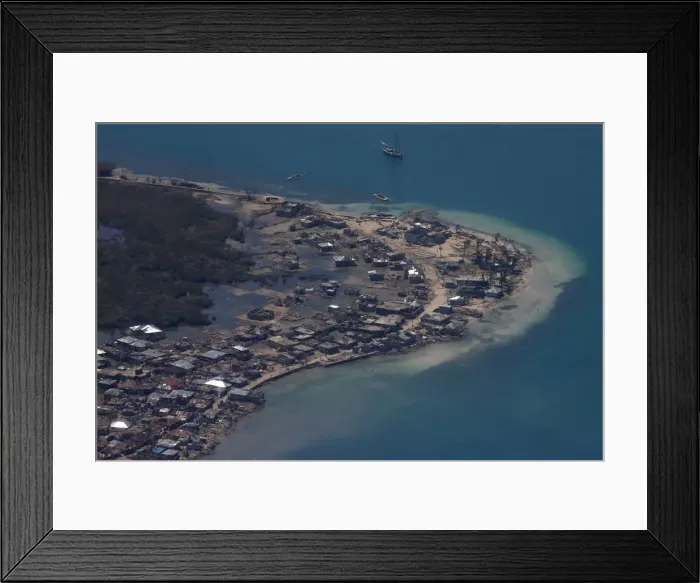 Framed Print : Destroyed houses are seen after Hurricane Matthew passes Grande Cayemite