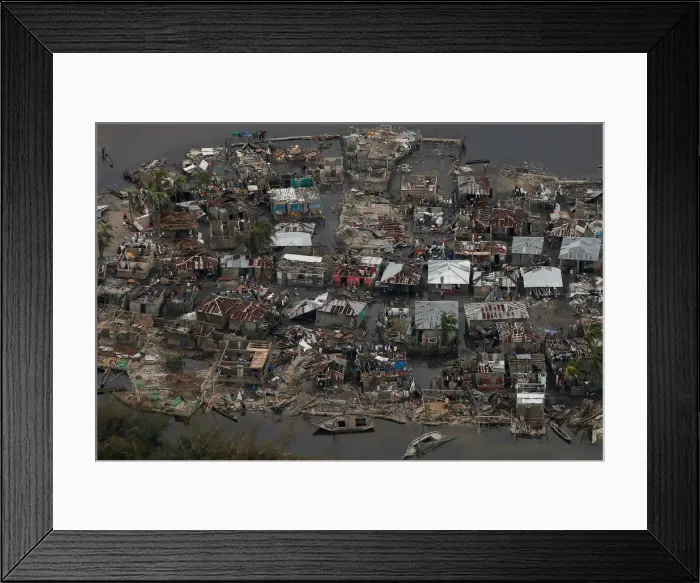 Framed Print : Destroyed houses are seen in a village after Hurricane Matthew passes Corail