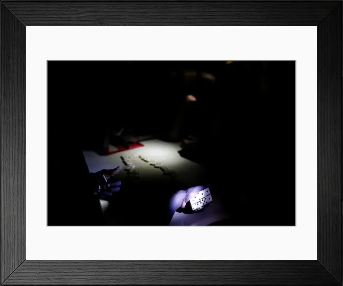 Framed Print : People play dominoes in a partially destroyed school used as a shelter after Hurricane Framed Print : People play dominoes in a partially destroyed school used as a shelter after Hurricane