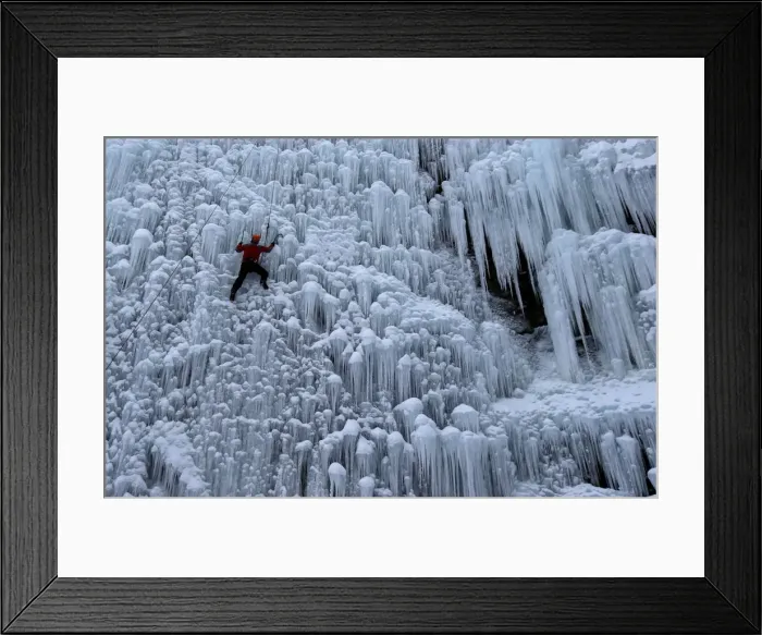 Framed Print : A man climbs an artificial wall of ice in the city of Liberec Framed Print : A man climbs an artificial wall of ice in the city of Liberec