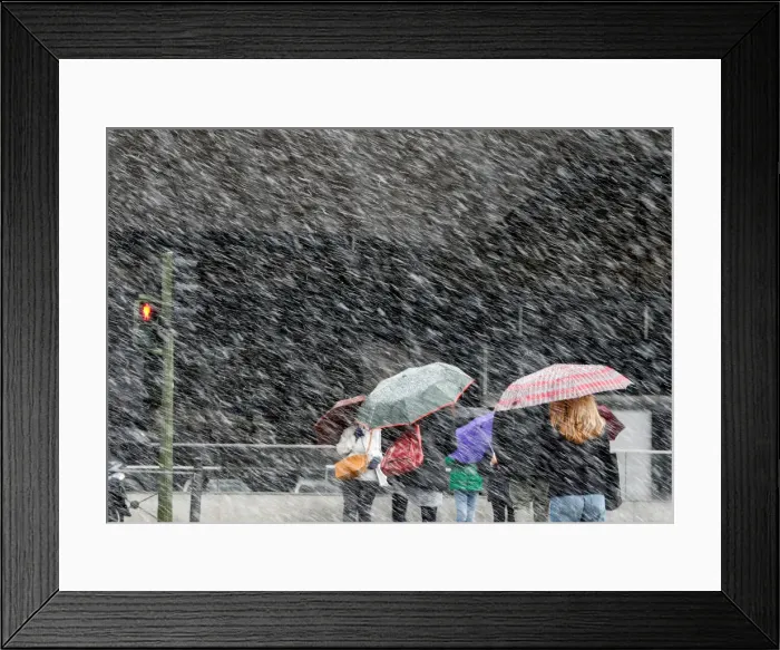 Framed Print : People cross a street during a heavy snowfall in Madrid Framed Print : People cross a street during a heavy snowfall in Madrid