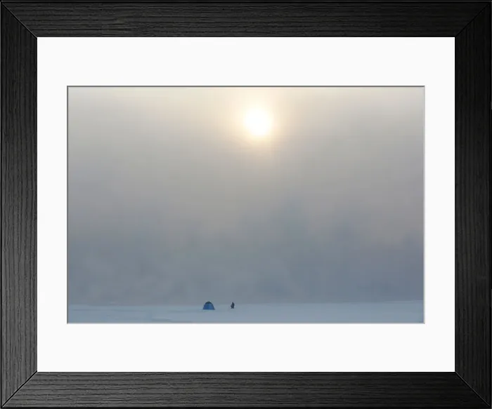 Framed Print : A fisherman sits on an ice-covered bay of the Yenisei River in Krasnoyarsk Framed Print : A fisherman sits on an ice-covered bay of the Yenisei River in Krasnoyarsk