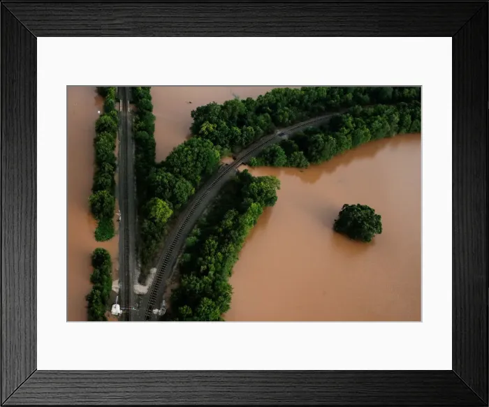 Framed Print : Railway lines are seen surrounded by flood waters caused by Tropical Storm Harvey near Framed Print : Railway lines are seen surrounded by flood waters caused by Tropical Storm Harvey near