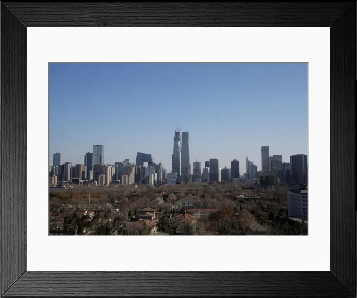 Framed Print : Buildings are seen against blue sky after the wind dispelled dangerously high levels of Framed Print : Buildings are seen against blue sky after the wind dispelled dangerously high levels of