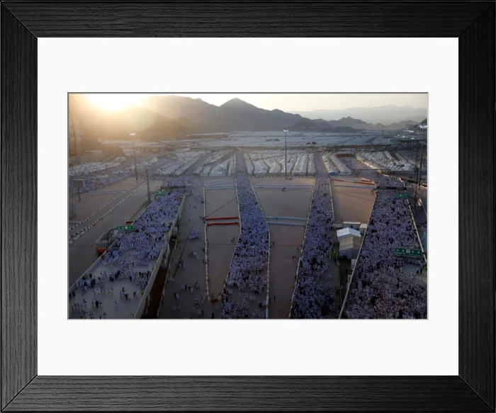 Framed Print : Muslim pilgrims walk on roads as they head to cast stones at pillars symbolizing Satan Framed Print : Muslim pilgrims walk on roads as they head to cast stones at pillars symbolizing Satan