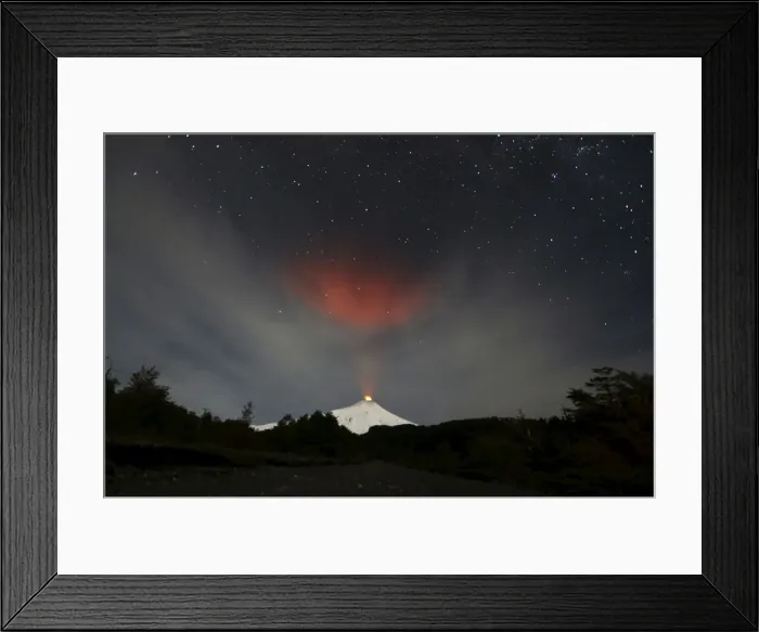 Framed Print : Smoke rises from Villarrica volcano as seen near the town of Pucon in southern Chile Framed Print : Smoke rises from Villarrica volcano as seen near the town of Pucon in southern Chile