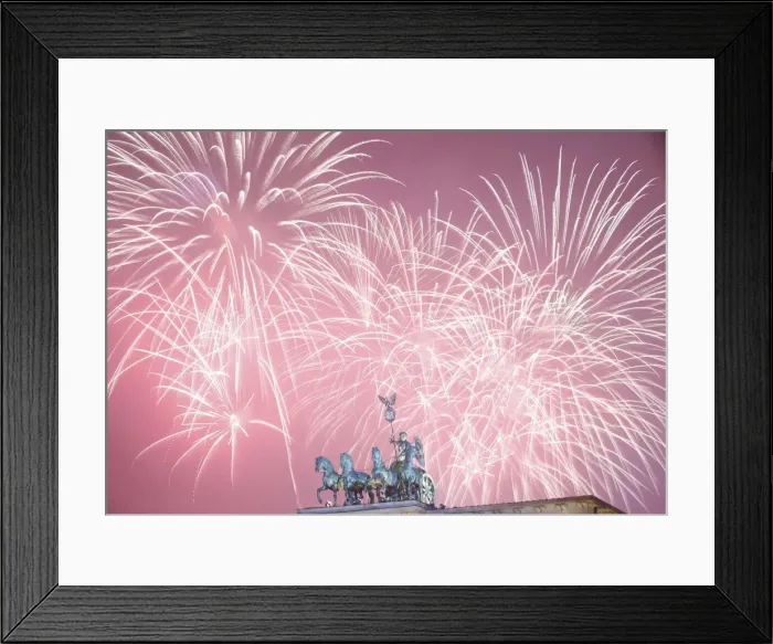 Framed Print : Fireworks explode next to the Quadriga sculpture atop the Brandenburg gate during New Framed Print : Fireworks explode next to the Quadriga sculpture atop the Brandenburg gate during New
