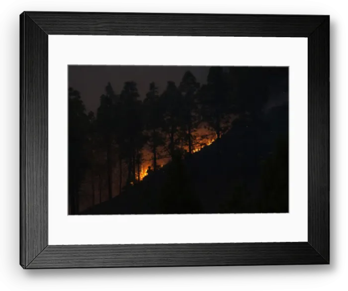 Framed Print : Firefighters work to put out a fire in the forest area of La Cumbre Framed Print : Firefighters work to put out a fire in the forest area of La Cumbre