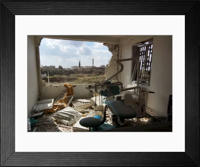 Framed Print : A view shows a damaged clinic after airstrikes by pro-Syrian government forces in Framed Print : A view shows a damaged clinic after airstrikes by pro-Syrian government forces in