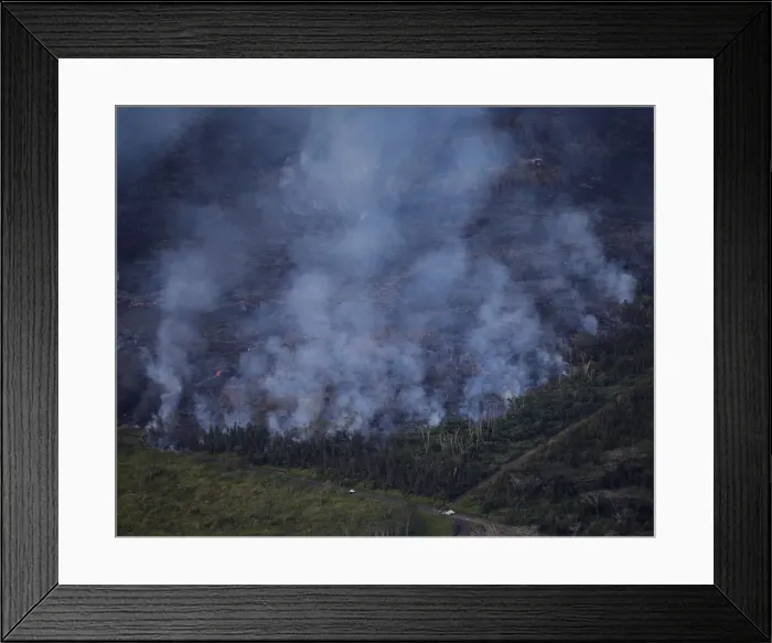 Framed Print : Lava advances through a wooded area in the Leilani Estates near Pahoa, Hawaii Framed Print : Lava advances through a wooded area in the Leilani Estates near Pahoa, Hawaii