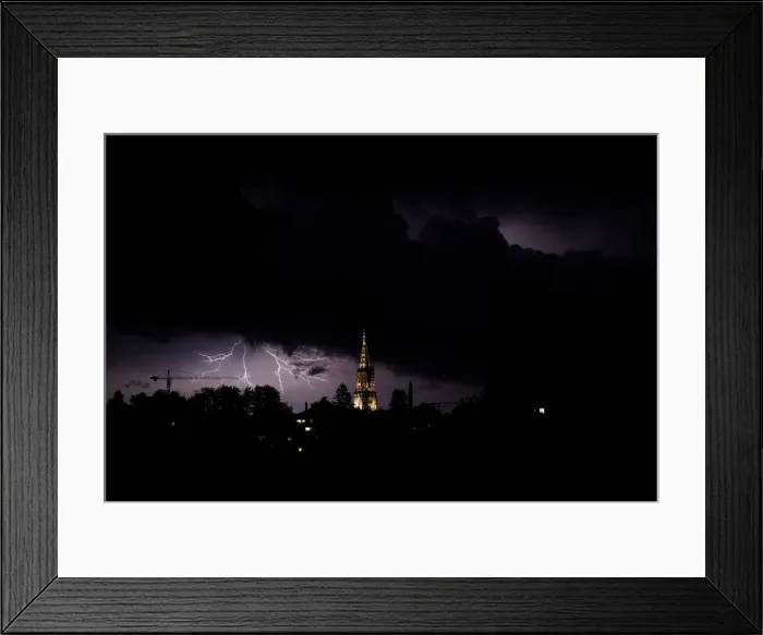 Framed Print : Lightning illuminates the sky above the Muenster Cathedral in Bern Framed Print : Lightning illuminates the sky above the Muenster Cathedral in Bern