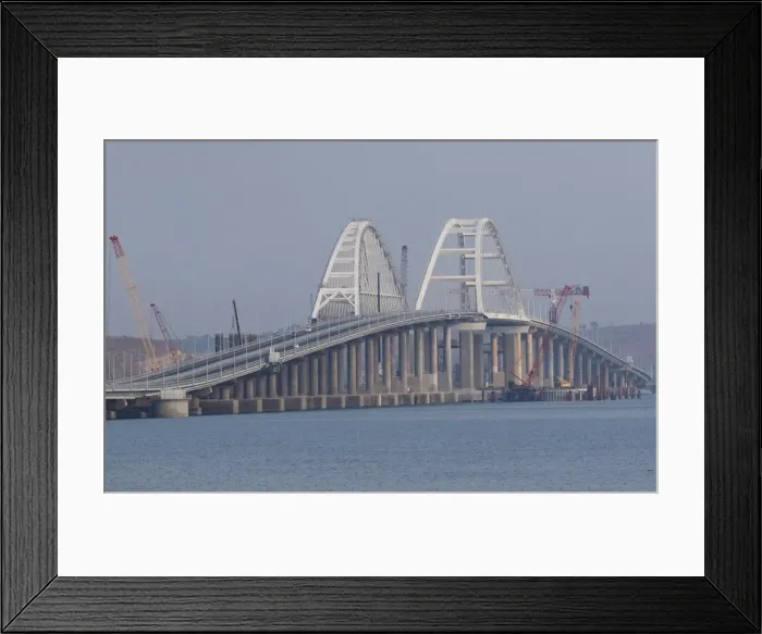 Framed Print : Cars drive along a bridge, which was constructed to connect the Russian mainland with