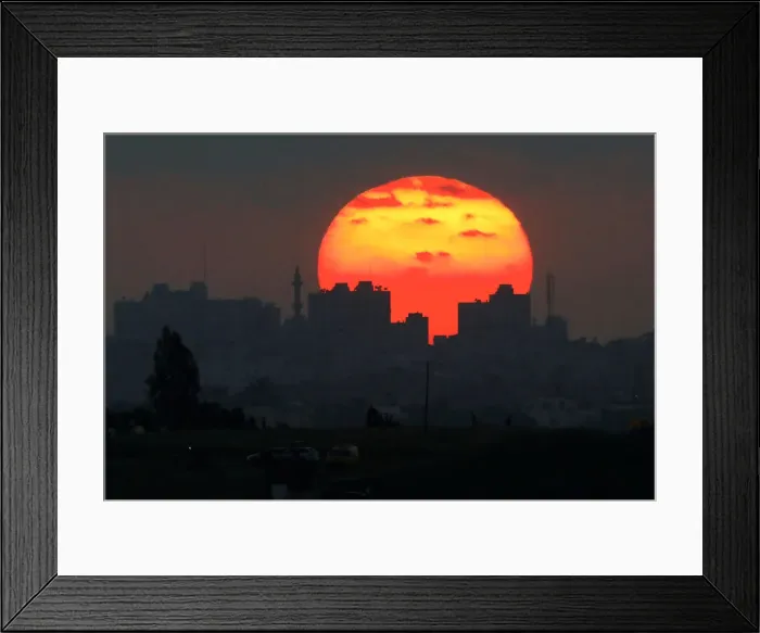 Framed Print : The sun sets over the Gaza Strip, as seen from the Israeli side of the border Framed Print : The sun sets over the Gaza Strip, as seen from the Israeli side of the border