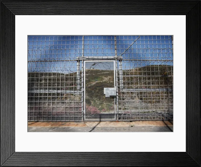 Framed Print : The border fence separating Spains northern enclave Ceuta and Morocco is seen from Ceuta Framed Print : The border fence separating Spains northern enclave Ceuta and Morocco is seen from Ceuta