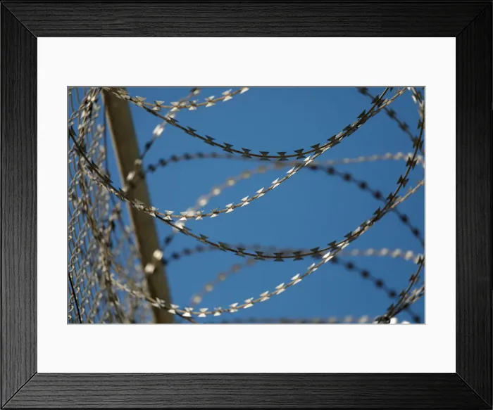 Framed Print : The border fence separating Spains northern enclave Ceuta and Morocco is seen from Ceuta Framed Print : The border fence separating Spains northern enclave Ceuta and Morocco is seen from Ceuta