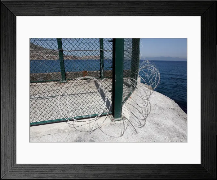 Framed Print : The border fence separating Spains northern enclave Ceuta and Morocco is seen from Ceuta Framed Print : The border fence separating Spains northern enclave Ceuta and Morocco is seen from Ceuta