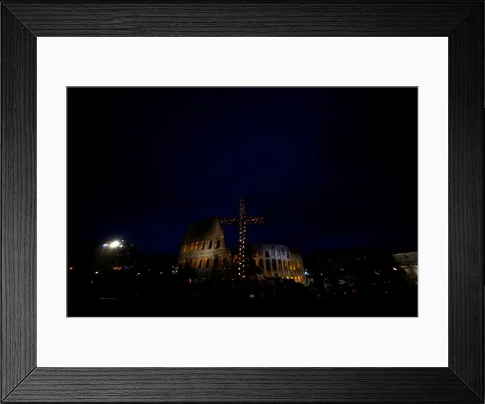 Framed Print : A cross lit up with candles is seen in front of the Colosseum before the Via Crucis Framed Print : A cross lit up with candles is seen in front of the Colosseum before the Via Crucis