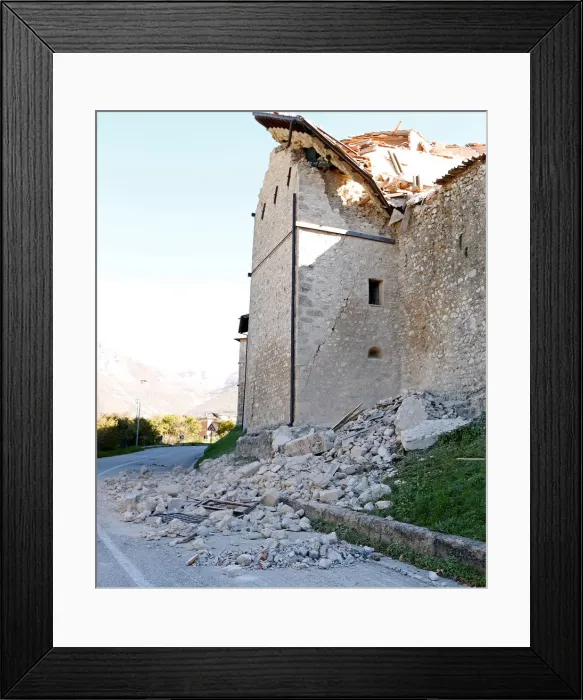 Framed Print : A partially collapsed building is seen following an earthquake in Norcia Framed Print : A partially collapsed building is seen following an earthquake in Norcia