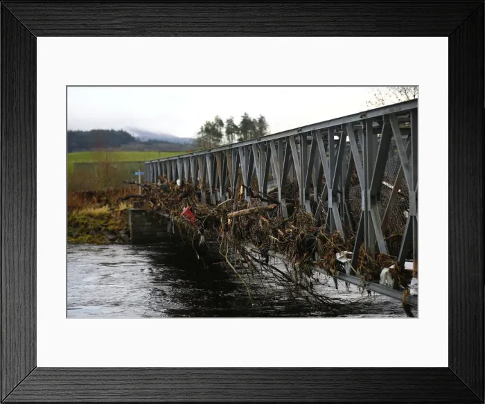 Framed Print : A footbridge lies littered with debris following flooding at Newton Stewart in Scotland Framed Print : A footbridge lies littered with debris following flooding at Newton Stewart in Scotland