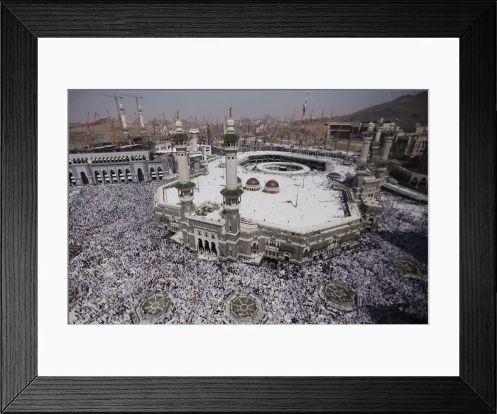 Framed Print : Muslim pilgrims attend Friday prayers at the Grand mosque in the holy city of Mecca ahead