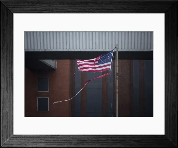 Framed Print : A tattered U. S. flag flies at the Con Edison Substation in Downtown Manhattan after Framed Print : A tattered U. S. flag flies at the Con Edison Substation in Downtown Manhattan after