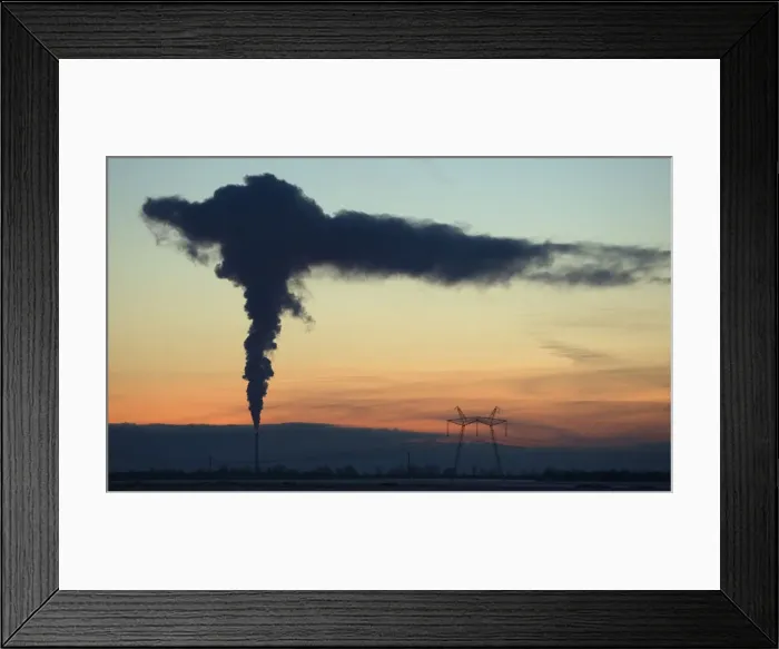 Framed Print : Smoke rises from the chimney stalk of a gas-fired power station during a windless evening Framed Print : Smoke rises from the chimney stalk of a gas-fired power station during a windless evening