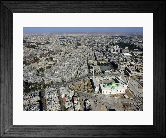 Framed Print : A general view taken with a drone shows a mosque where forces loyal to Syrias President