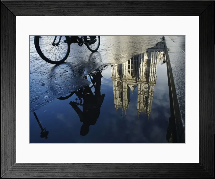 Framed Print : A cyclist is reflected in a puddle as he passes Westminster Abbey in London Framed Print : A cyclist is reflected in a puddle as he passes Westminster Abbey in London