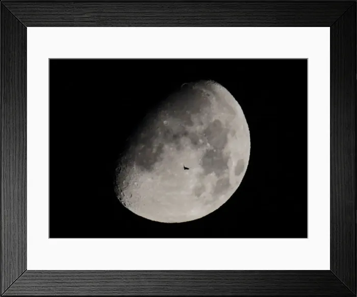 Framed Print : A passenger jet is silhouetted against the moon as it flies over Shanghai