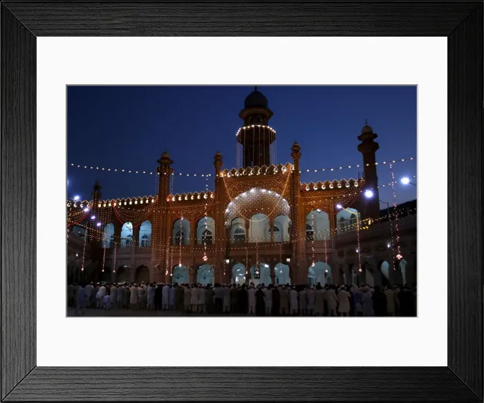 Framed Print : Men attend evening prayers during the last week of the Muslim fasting month of Ramadan Framed Print : Men attend evening prayers during the last week of the Muslim fasting month of Ramadan
