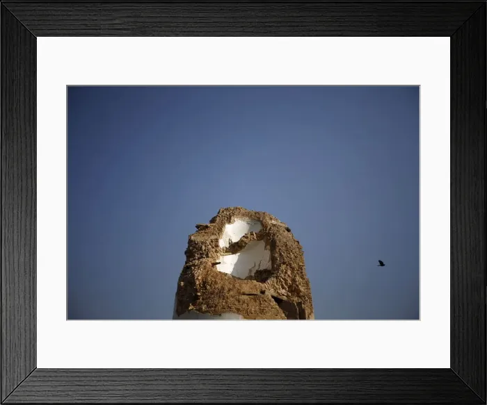 Framed Print : A historic nine-storey Dharara tower damaged by an earthquake is seen during the first Framed Print : A historic nine-storey Dharara tower damaged by an earthquake is seen during the first