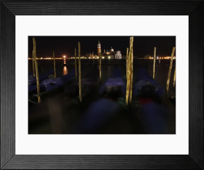 Framed Print : Gondolas are seen along the Canal Grande in front of San Giorgio Maggiore church in