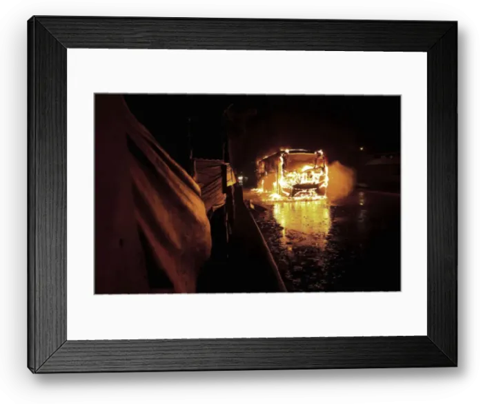 Framed Print : Bus is seen on fire in front of Pinheirinho slum where residents try to fight eviction Framed Print : Bus is seen on fire in front of Pinheirinho slum where residents try to fight eviction