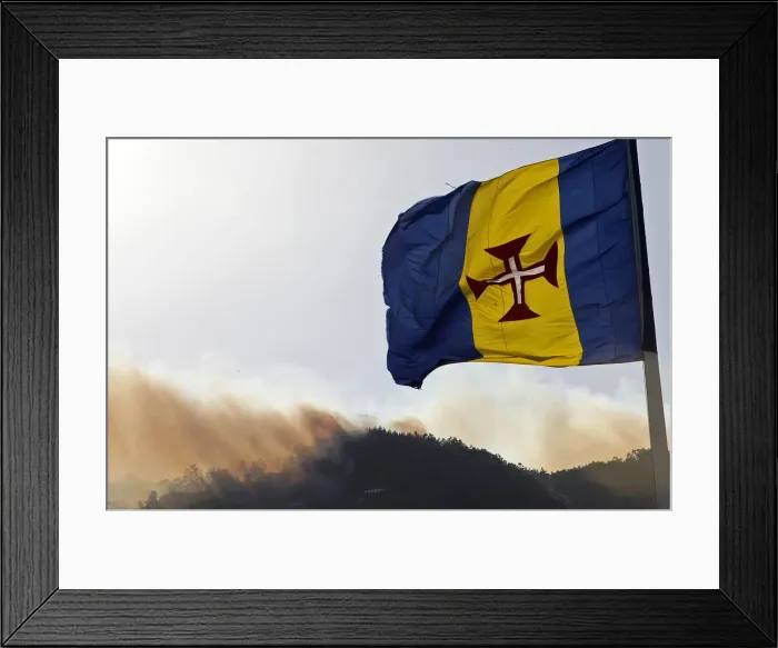 Framed Print : Smoke from forest and bush fires rise from the mountains on the Portuguese island of