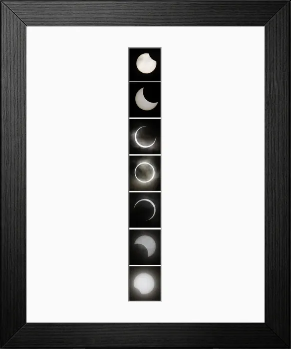 Framed Print : A combination photo shows an annular eclipse seen in Tokyo