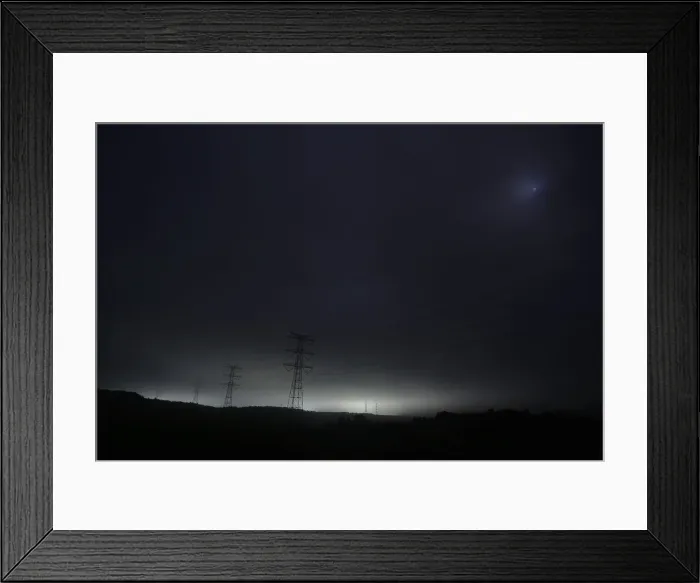 Framed Print : Light and power lines come from tsunami-crippled Daiichi nuclear power plant as seen Framed Print : Light and power lines come from tsunami-crippled Daiichi nuclear power plant as seen