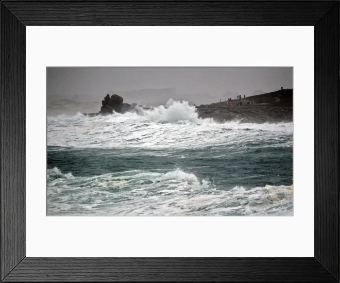 Framed Print : People standing on the Pointe de la Torch peninsula watch waves breaking on the Brittany Framed Print : People standing on the Pointe de la Torch peninsula watch waves breaking on the Brittany
