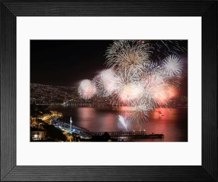 Framed Print : Fireworks explode during a pyrotechnic show to celebrate the new year in the coastal city Framed Print : Fireworks explode during a pyrotechnic show to celebrate the new year in the coastal city