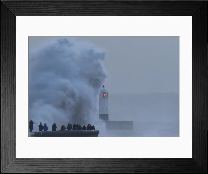Framed Print : People view large waves and high winds associated with Storm Eleanor as they hit