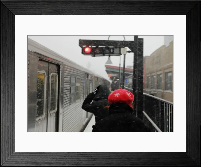 Framed Print : Commuters prepare to board a subway car at an outdoor station in Brooklyn during a Framed Print : Commuters prepare to board a subway car at an outdoor station in Brooklyn during a