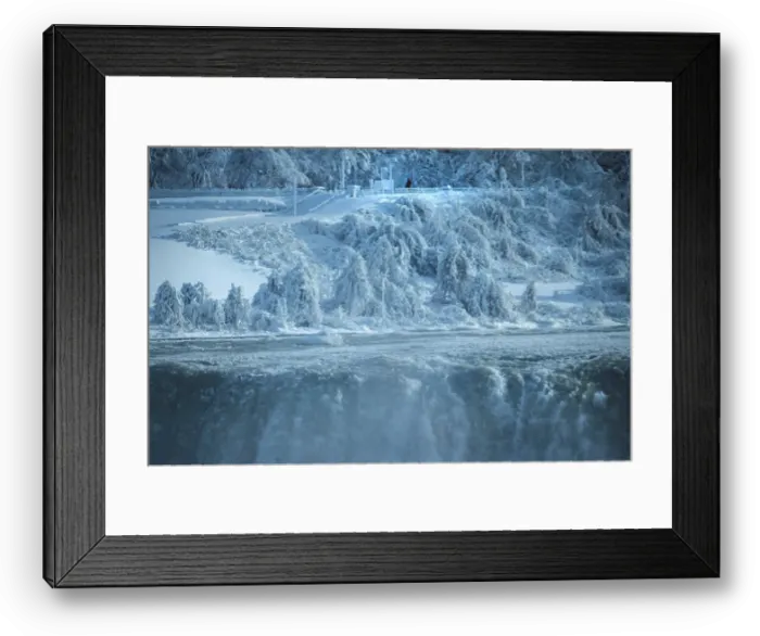 Framed Print : A lone visitor on the United States side of the Niagara River watches as ice chunks Framed Print : A lone visitor on the United States side of the Niagara River watches as ice chunks