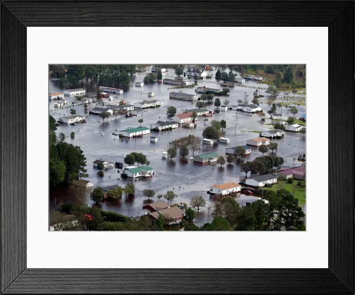 Framed Print : Houses sit in floodwater caused by Hurricane Florence, in this aerial picture