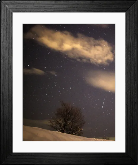 Framed Print : A meteor streaks past stars in the night sky over the village of Pesevici Framed Print : A meteor streaks past stars in the night sky over the village of Pesevici