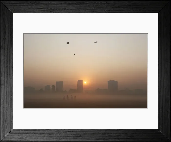 Framed Print : Joggers stand amid dense fog on a cold winter morning in Kolkata Framed Print : Joggers stand amid dense fog on a cold winter morning in Kolkata