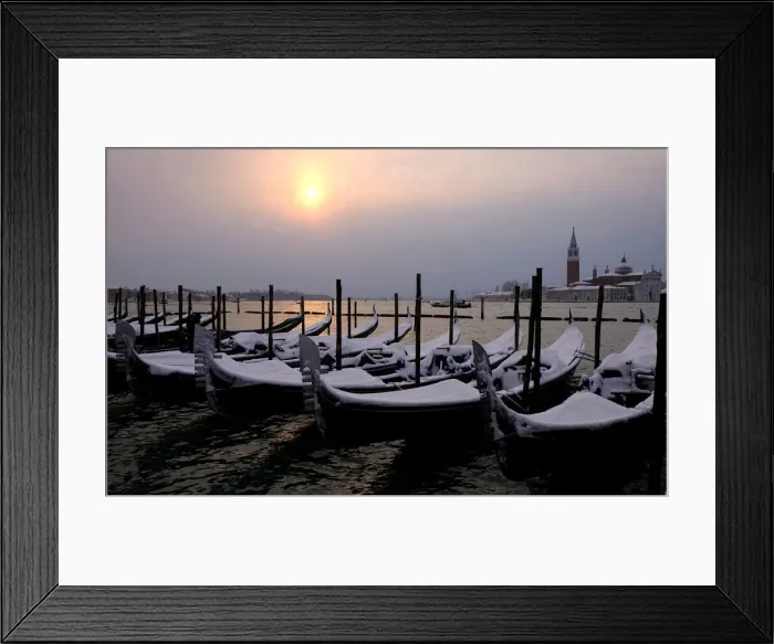 Framed Print : Snow covered gondolas are seen near St. Mark square in Venice lagoon Framed Print : Snow covered gondolas are seen near St. Mark square in Venice lagoon