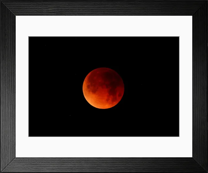 Framed Print : Stars can be seen around a lunar eclipse in Oceanside, California Framed Print : Stars can be seen around a lunar eclipse in Oceanside, California