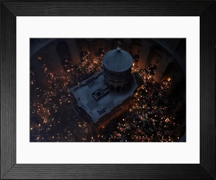 Framed Print : Worshippers hold candles as they take part in the Christian Orthodox Holy Fire ceremony