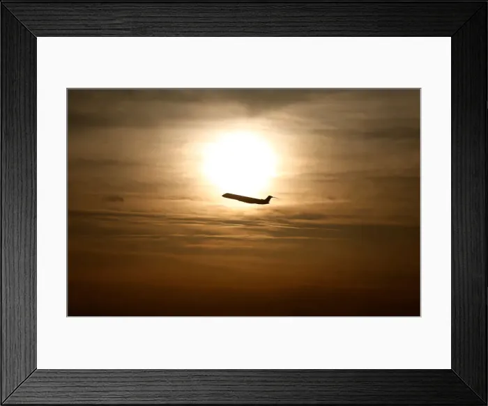 Framed Print : A plane is seen during sunrise at the international airport in Munich Framed Print : A plane is seen during sunrise at the international airport in Munich