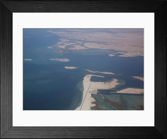 Framed Print : An aerial view of Arabian Gulf with city of Abu Dhabi is pictured through the window of Framed Print : An aerial view of Arabian Gulf with city of Abu Dhabi is pictured through the window of